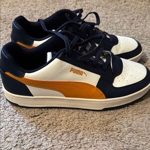 Puma Navy and White Sneakers with Bold Orange Stripe
